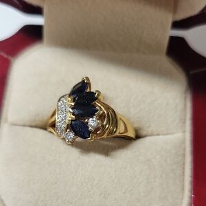 Gold Plated Ring with Dark Blue Stone Accents